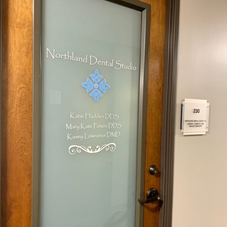 A door with the words northland choral studio written on it.